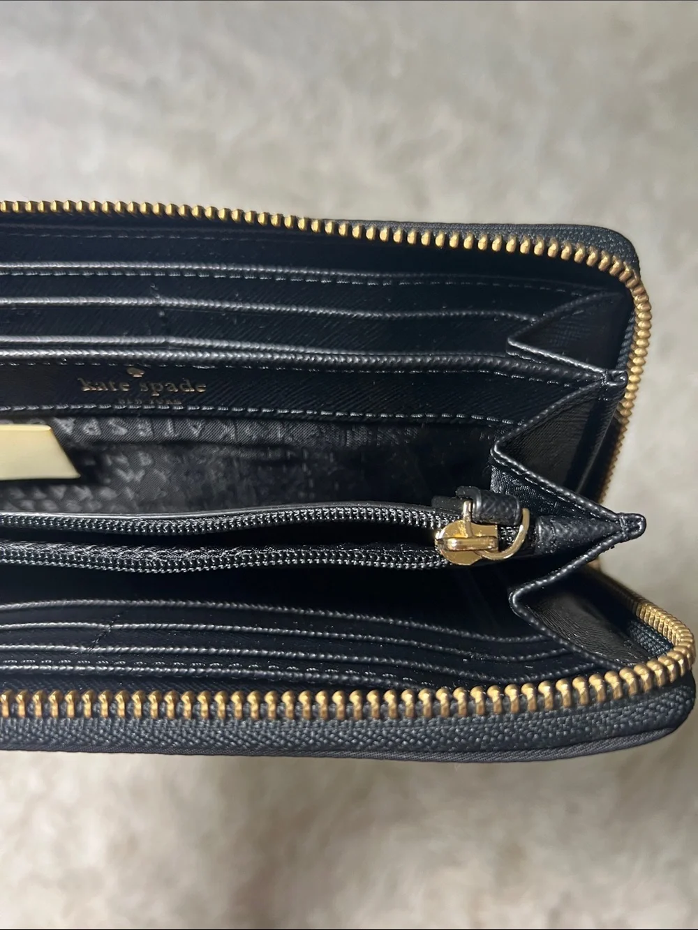 kate spade Black Zip-Around Logo Plate Wallet